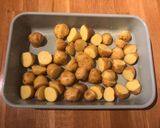 A picture of step 1 of Charlotte potato, green bean and bean sprout tray bake with peanut, coconut and chilli dressing.
