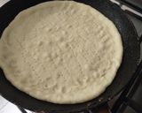 A picture of step 3 of Instant chicken Tikka Pizza in frying pan.