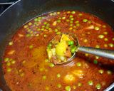 A picture of step 3 of Masala laccha paratha with aloo matar in tomato gravy.