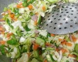 A picture of step 2 of Fried Schezwan rice.