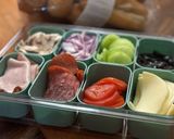 A picture of step 2 of Subway at home/ sub board.