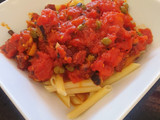 Pasta in spicy chorizo tomato sauce with capers