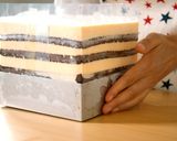 A picture of step 16 of Tiramisu, and Cocoa Sponge with plenty of Coffee Syrup.