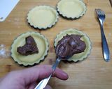 Foto del passaggio 3 della ricetta Crostatine alla Nutella®