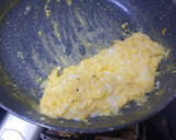 A picture of step 2 of Lazy Scrambled Eggs with Milk and Cheese.