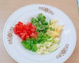 A picture of step 2 of Ajwain leaf salad with veggies and pineapple.