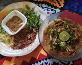 A picture of step 8 of Beef haleem with boil rice.