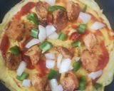 A picture of step 3 of Egg pizza on a pan.