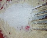 A picture of step 7 of Red Velvet çhoçolate inside Cupcakes with cream cheese frosting.