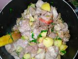 Fried nduma with beef and potato served. with spinach