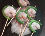 A picture of step 5 of Orange glazed prawn stick.
