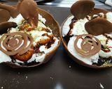 A picture of step 2 of Chocolate cup with brownie and icecream on top.