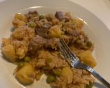 A picture of step 6 of Rice mixed with beef and peas.