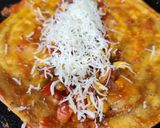 A picture of step 4 of Cheese Schezwan Pizza Frankie.