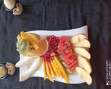 A picture of step 3 of Fresh Fruits and Mango juice.