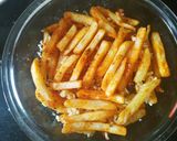 A picture of step 4 of French fries pizza.