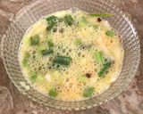 A picture of step 2 of Chessy green onion omelet.