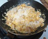 A picture of step 3 of Bacon egg and cheese sandwich.