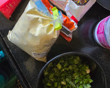 A picture of step 1 of Methi spring onion Dhebra.