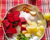 A picture of step 1 of Immunity Booster Drink (Beetroot Amla Mint Garlic juice).