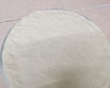 A picture of step 4 of Choma sausage pizza.