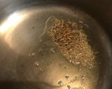 A picture of step 1 of Broken wheat Khichdi.