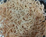 A picture of step 2 of American chopsuey with fried rice.