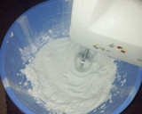 A picture of step 2 of Whipped cream frosting with strawberry.