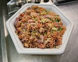 Une image de l'étape 14 de Torsades rouges au lard, petits pois et Boursin®️.