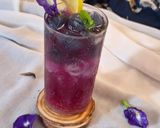 A picture of step 4 of Blue pea magic layered mocktail.