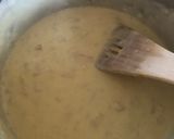 A picture of step 9 of Anti Vampire Cheese Sauce, with Onions and Garlic.