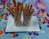 A picture of step 7 of Bosomat or Egyptian Breadsticks with Sesame Seeds.
