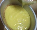 A picture of step 3 of Yakult Tripe layered choco custard biscuit cake.
