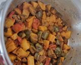 A picture of step 3 of Brinjal potato mint masala.