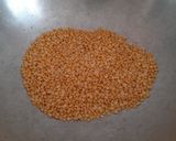 A picture of step 1 of Ragi mung dal ladoo.
