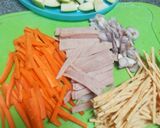 A picture of step 2 of Thai Style Apple Ham Salad with Fish Strings Snack.