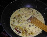 A picture of step 4 of Punjabi kadhi with green peas and coriander rice.