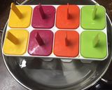 A picture of step 5 of Watermelon Lemonade Popsicles.