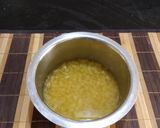 A picture of step 4 of Gujarati lunch (rasadar aloo sabji, amrakhand, puri, dal, rice).
