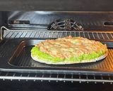A picture of step 5 of Tuna melt on pita bread - open sandwich.