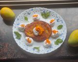 A picture of step 6 of Mango malpua with fresh cream.