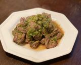 A picture of step 8 of Chicken Hearts Yakitori style (no skewer) Leek Green on top.