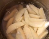 A picture of step 2 of Baked Spiced potato wedges with garlic Bechamel sauce.