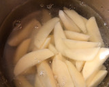A picture of step 2 of Baked Spiced potato wedges with garlic Bechamel sauce.