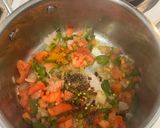 A picture of step 6 of Yellow Rice with Jalapeños and Tomatoes.