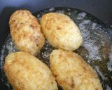 A picture of step 8 of Arancini - mozzarella and ragù stuffed rice balls.