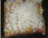 A picture of step 4 of Corn Cheese Bread Pizza.