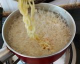 A picture of step 1 of Fried Instant noodles loaded with Sausages and vegies.