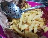 A picture of step 2 of Orange flavoured chips masala.