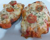 Foto del paso 5 de la receta Berenjenas rellenas con pisto y pollo, gratinadas